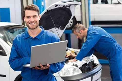 Mechanic Working on Computer