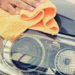 A man cleaning car with microfiber cloth, car detailing