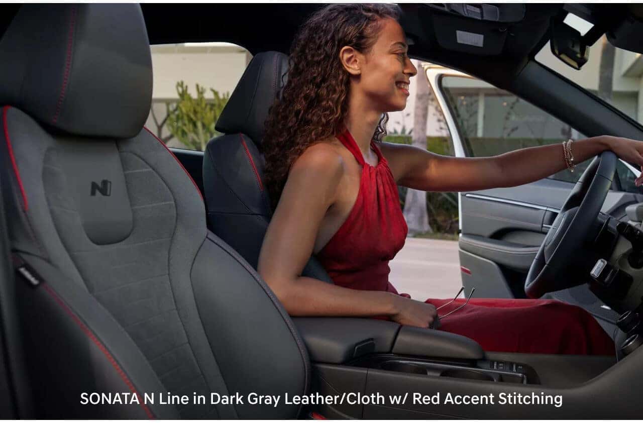 Sonata N Line in dark gray leather/cloth with red accent stitching