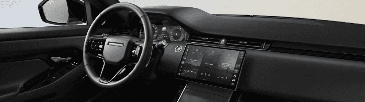 Interior dashboard of the Evoque showcasing touchscreen tech and premium materials