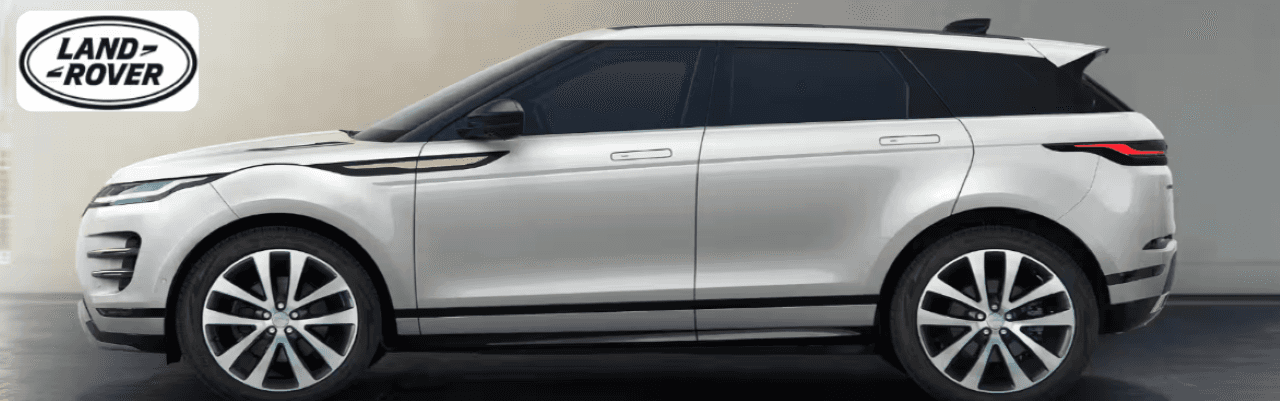 Sales consultant assisting a customer inside the Land Rover Dayton dealership, highlighting luxury off-road features.