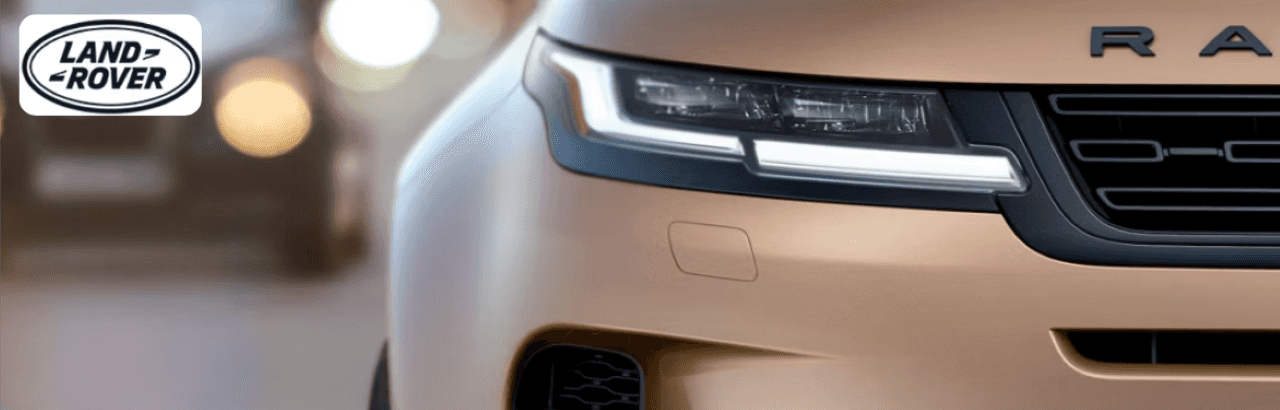 Land Rover Evoque Convertible driving through Dayton’s scenic suburbs with the top down.