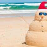 Snowman made of sand on the beach