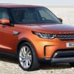 Orange 2019 Land Rover Discovery parked in desert