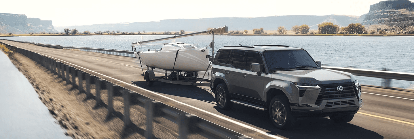 2024 Lexus GX towing a boat on a bridge2024 Lexus GX towing a boat on a bridge