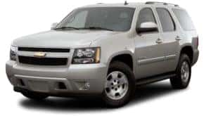 A silver 2009 used Chevy Tahoe is angled left on a white background.