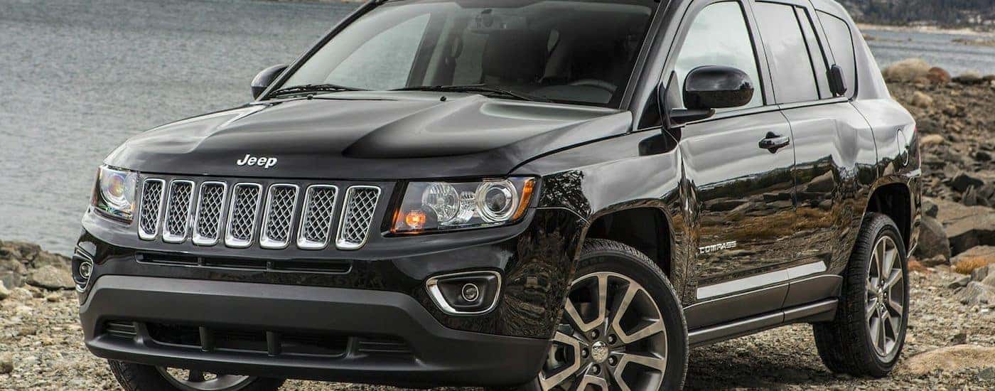Black 2015 Used Jeep Compass parked lakeside