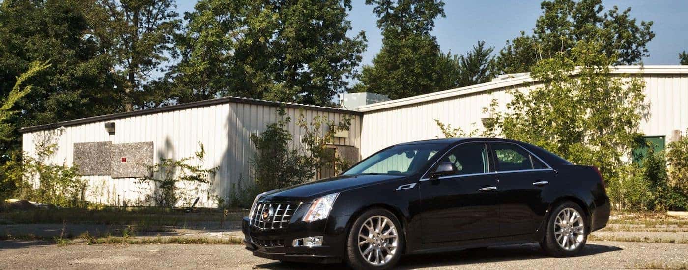 Black 2012 Used Cadillac CTS parked in front of a house