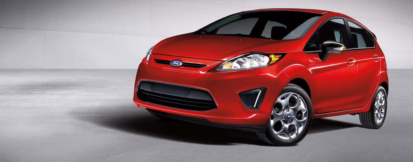 Red 2012 Used Ford Fiesta with gray background