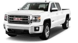 A white 2014 used GMC Sierra facing left on white
