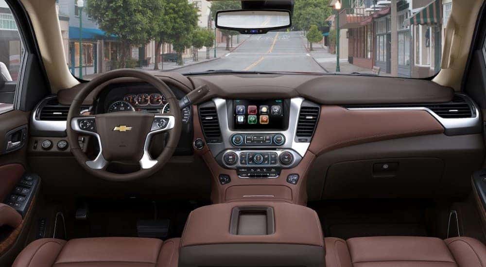 The brown interior of a 2018 Chevy Tahoe is shown.