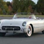 A parked white 1954 Chevy Corvette.