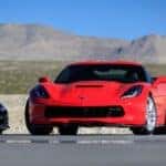 A red 2014 Chevy Corvette parked on a track.