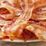 Cooked Greasy Bacon against a back ground