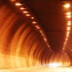 orange lit tunnel with batman car