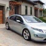 A silver 2011 Chevy Volt parked on a driveway.