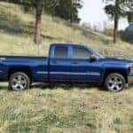 A blue 2014 Chevy Silverado 1500 Z71 parked off-road.