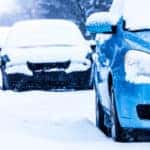Parked Cars in the Street on a Snowstorm Winter Day