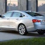 A parked silver 2017 Chevy Impala.