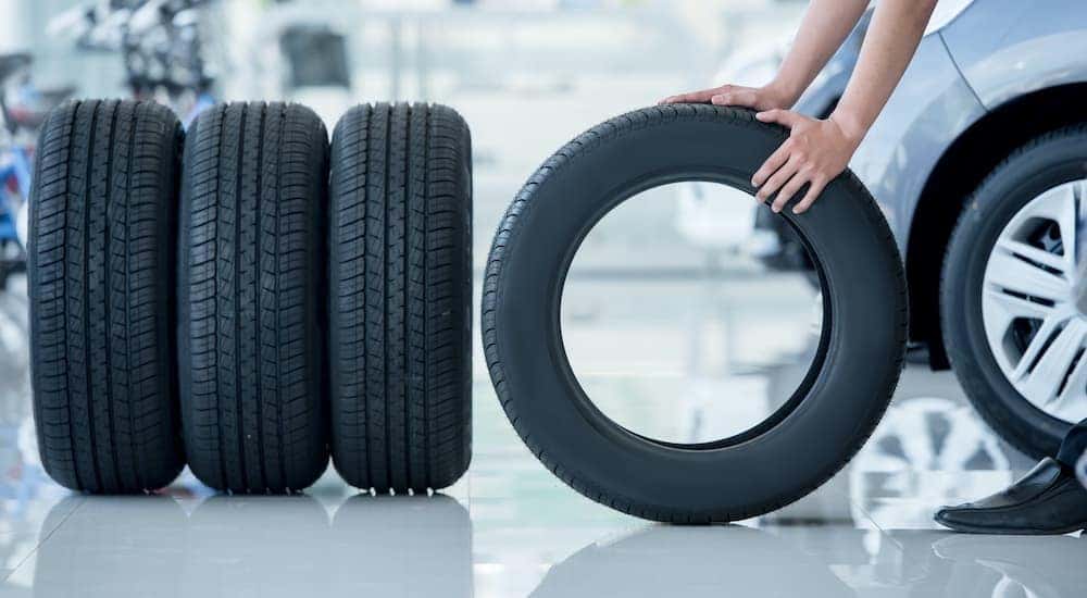 A set of tires are shown standing up at a Cincinnati used car dealer.