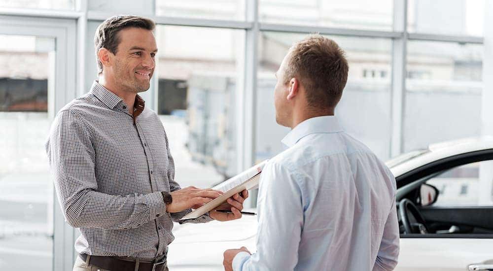 A salesman talking to a customer.