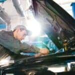 A mechanic working on a car.