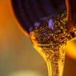 Oil being poured from a bottle.