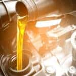 Oil being poured into an engine.