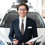 A salesman at a dealership.