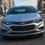 Silver 2017 Chevy Cruze driving down a road.