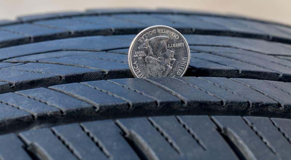 A quarter is in the tread of a tire in Cincinnati.