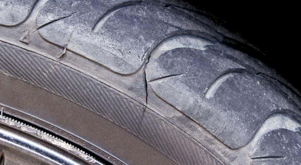 A closeup shows a damaged tire.
