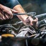 Mechanic repairing an engine.