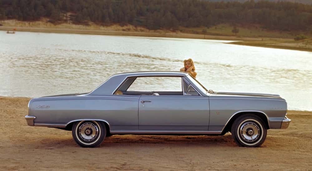 A silver 1964 Chevy Malibu from the side.