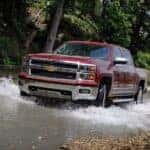 A red 2016 Chevy Silverado 1500 from the front.