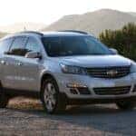 A silver 2016 Chevy Traverse parked off-road.