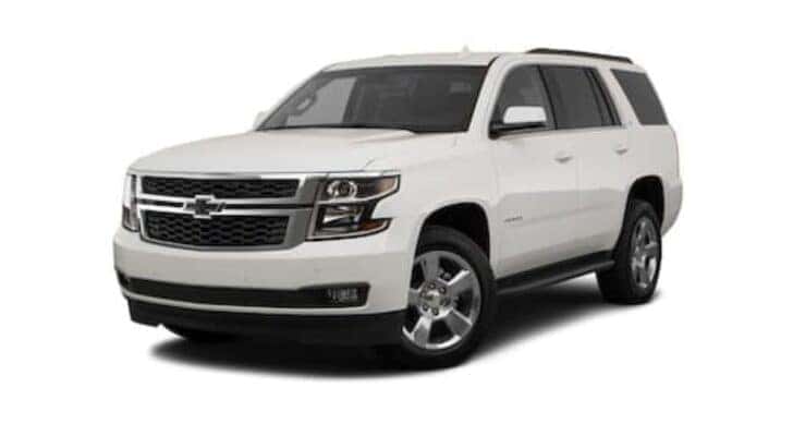 A white 2016 Chevy Tahoe angled left.
