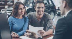 A couple is shown talking to a salesperson after searching 'Chevy dealers in KY.'