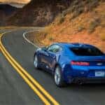 A blue 2016 Chevy Camaro from the rear.