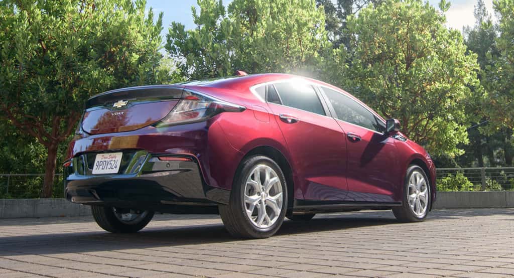 A red 2017 Chevy Volt in a park