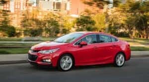 A red 2016 Chevy Cruze form the side.