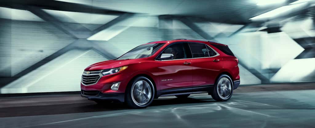 A red 2018 Chevrolet Equinox driving in a tunnel
