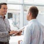 A salesman talking to a customer.