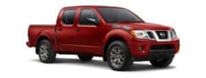 A red 2017 Nissan Frontier is angled right.
