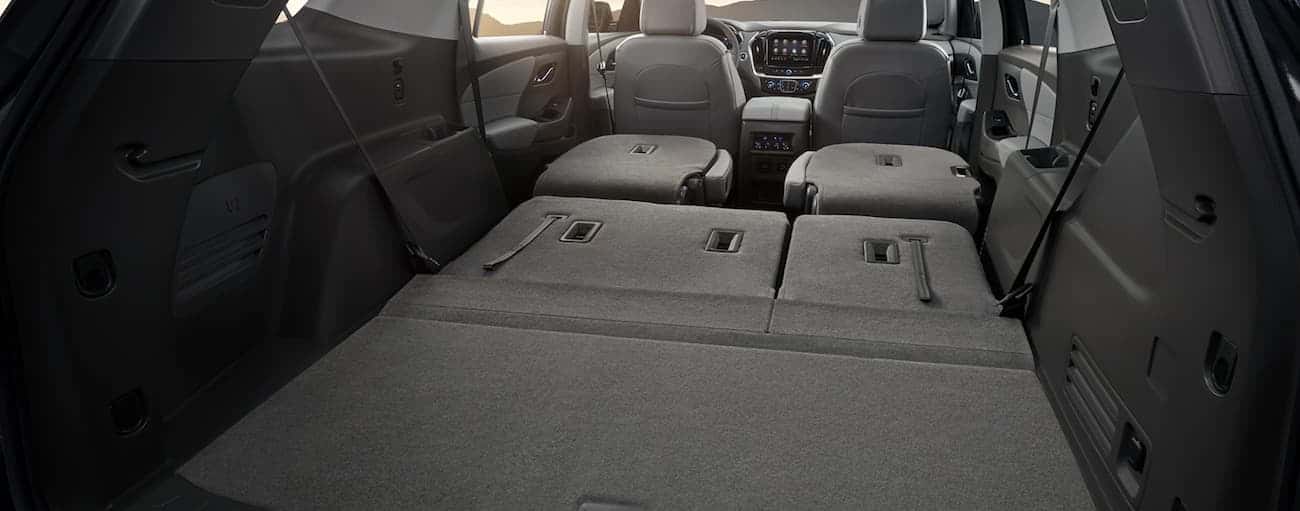 The rear gray cargo area in a 2020 Chevy Traverse.