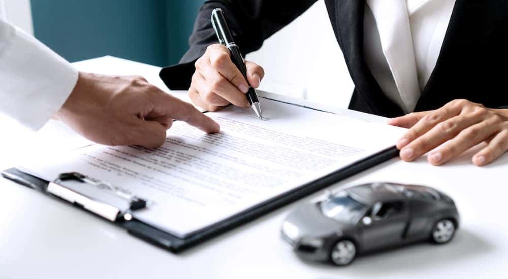 Someone filling out paperwork.