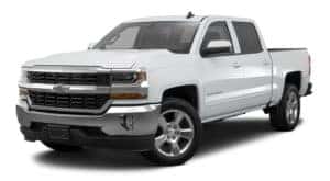 A white 2018 Chevy Silverado is parked and facing left.