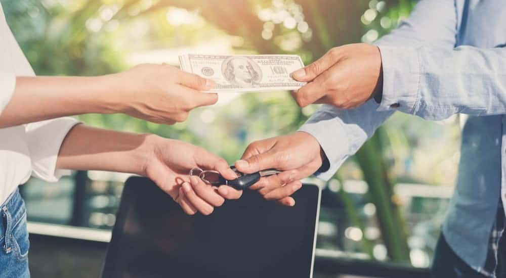 An exchange of money and keys.