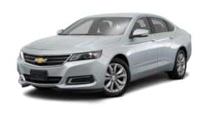 A silver 2018 Chevy Impala is parked and facing left.