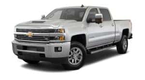 A silver 2018 Chevy Silverado 2500HD is parked and facing left.